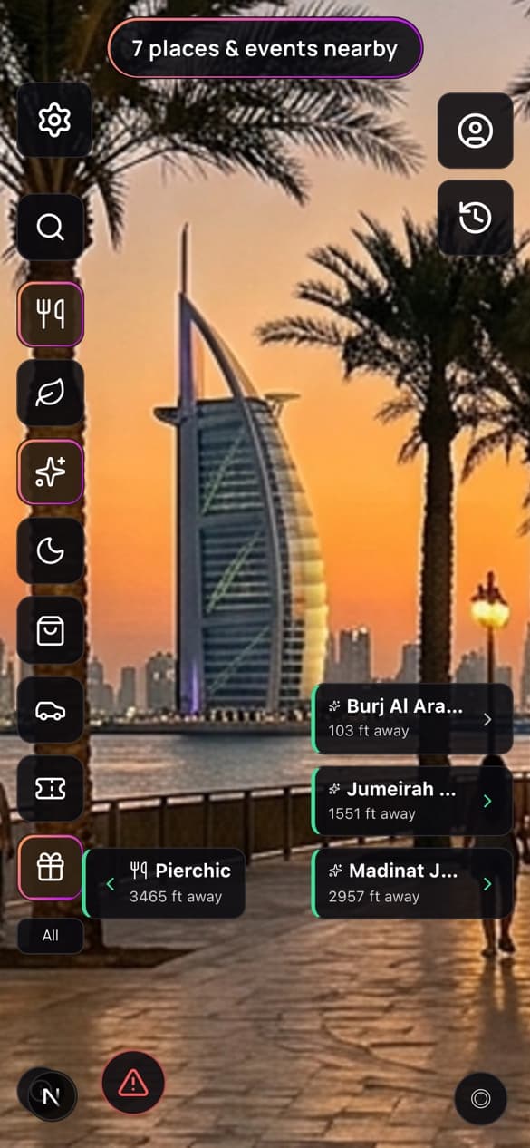 The bonuz camera view at the Burj Al Arab. Cards float beside the building showing Burj Al Arab 103 feet away, Jumeirah 1551 feet, Madinat Jumeirah 2957 feet and Pierchic 3465 feet.